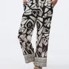 Pantalon chic beige motif